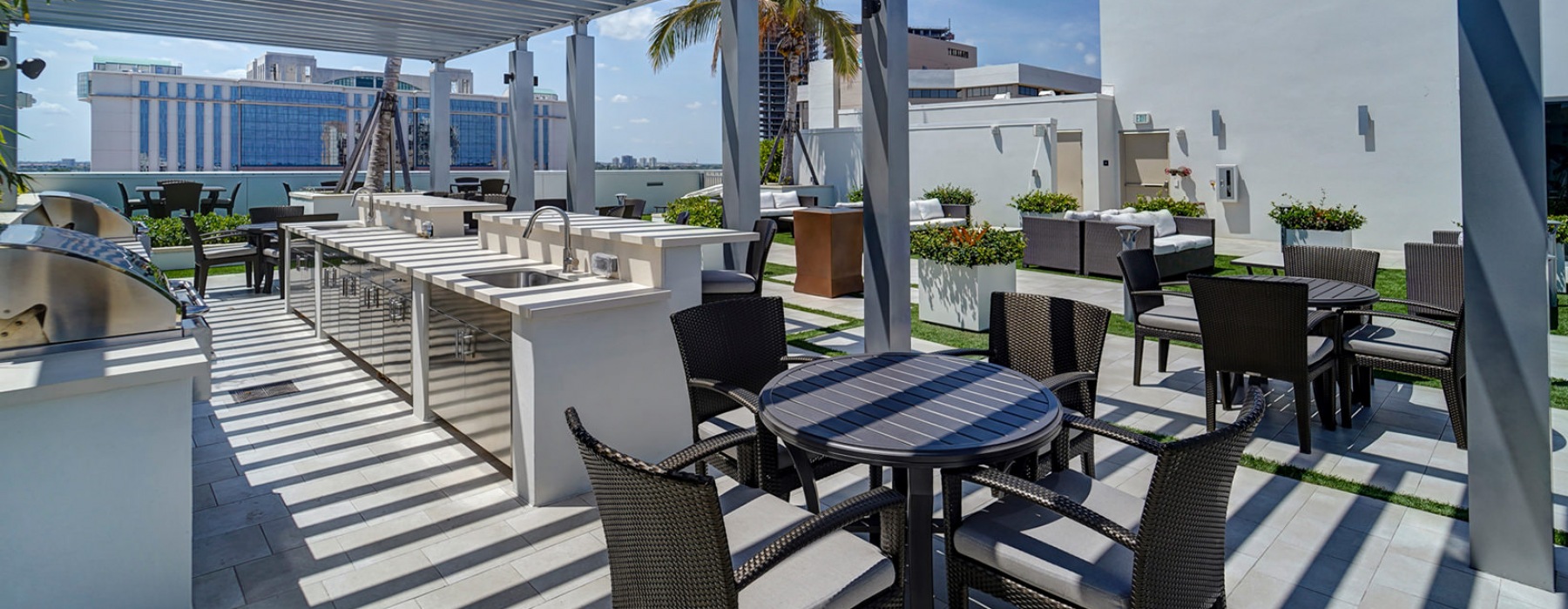 Oversea at Flagler Banyan Square outdoor grill and lounge area. 